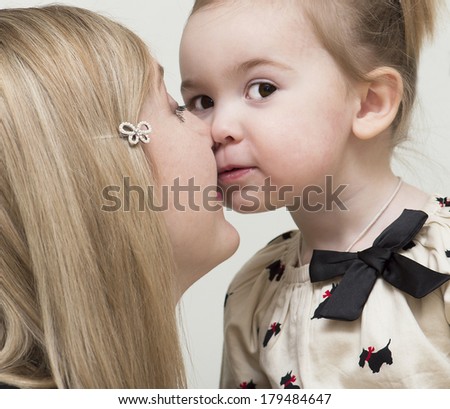 The daughter touches by a nose of a nose of mother.
