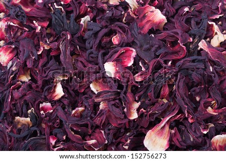 Dry hibiscus tea texture background