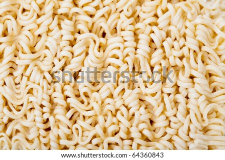 Macro shot of dried noodles. Suitable for concepts such as diet and nutrition, textures and backgrounds, and food and beverage.