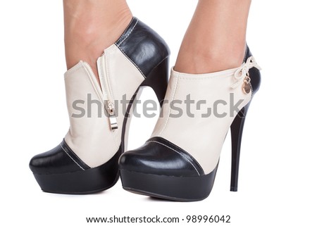 Woman wearing high heels on white background