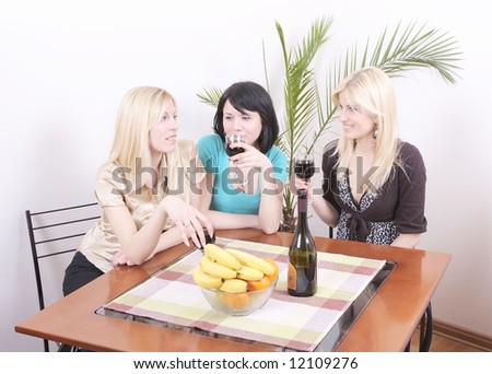 Ladies sitting and drinking wine