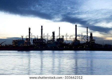 Oil refinery industry plant silhouette in the morning - Soft Focus