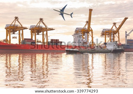 Fishing ships beside container cargo freight ship silhouette with the airplane in the morning.
