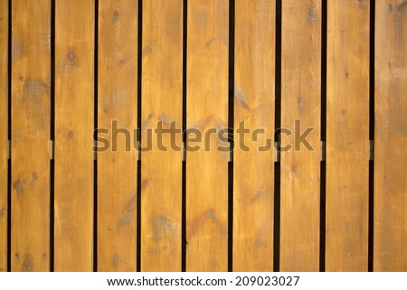 wood texture with natural patterns. Vertical wooden fence close up