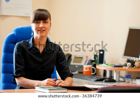 Portrait of an attractive businesswoman looking at camera in an office environment