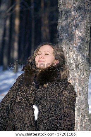 The girl in a fur coat, cold winter day