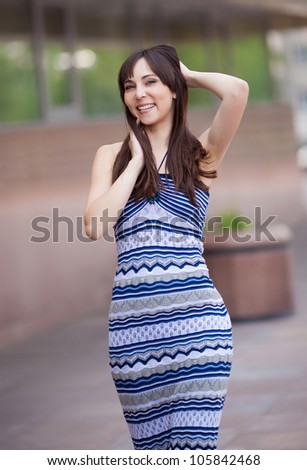 young laughing woman, outdoor on a summer day