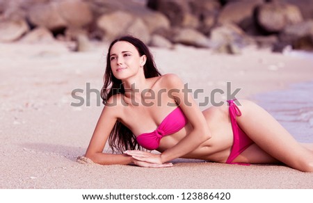beautiful young woman relaxing on the beach