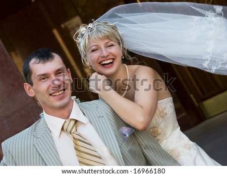 happy laughing bride and groom outdoor