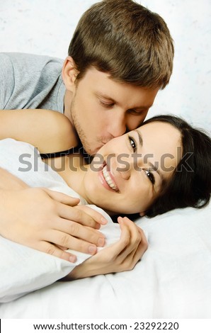 http://image.shutterstock.com/display_pic_with_logo/199288/199288,1231948553,1/stock-photo-happy-young-man-and-woman-wake-up-in-the-morning-in-bed-and-kiss-23292220.jpg