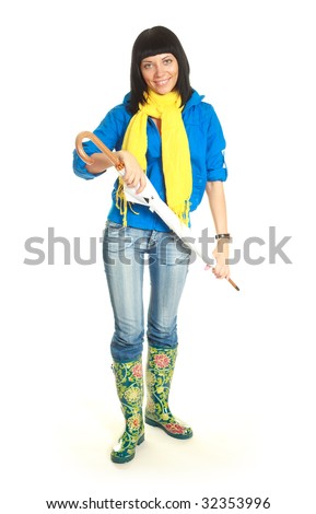 pretty young brunette girl holding a closed umbrella