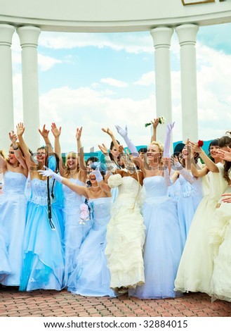 KRASNOYARSK, RUSSIA - JUNE 21: group of happy excited brides with their hands up at Parade of Brides June 21, 2009 in Krasnoyarsk. The annual summer event takes place in many Russian cities.