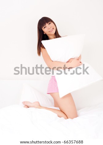young brunette woman on the bed at home