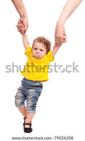 happy young family; mother and father holding their daughter, making her first steps, isolated against white background