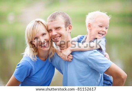 happy young family  spending time outdoor on a summer day