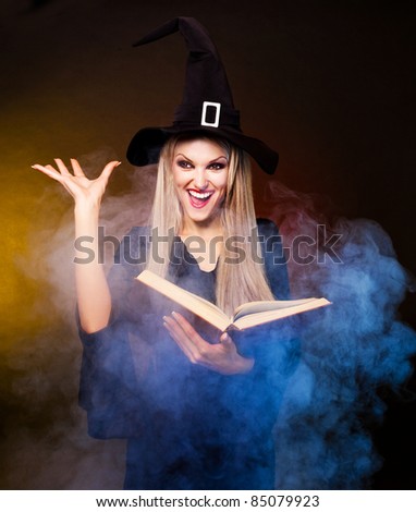 angry  blond witch with a book and her hands and clouds of blue smoke around her conjuring, against black and yellow background
