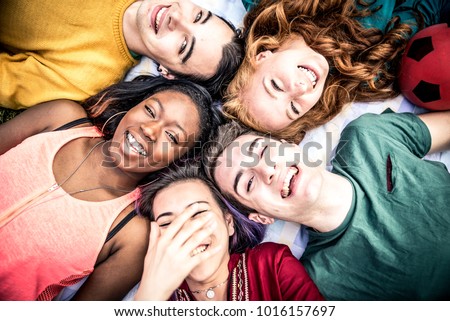 Group of  friends laughing out loud outdoor, sharing good and positive mood.