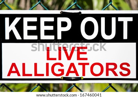 Keep out,live alligators zone signboard