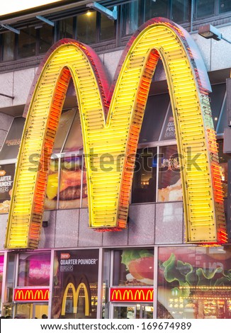 New York - December 22, 2013: Sign-Logo Of The Chain Mc Donald\'S In Times Square,New York.This Fast Food Restaurant Is One Of The Most Productive Mc Donald\'S In The World.