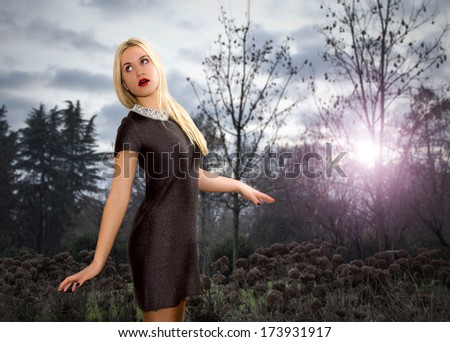 blonde girl gets lost in a gloomy woods