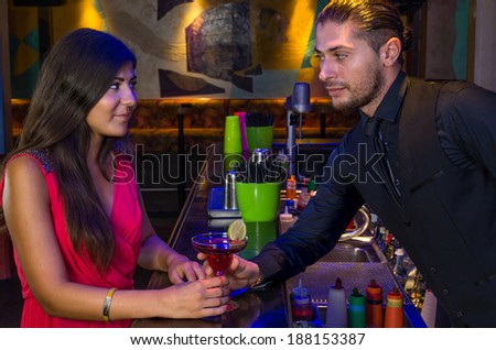 handsome bartender seduces a beautiful woman
