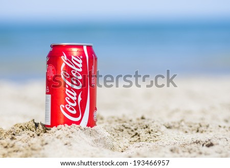 Rimini,Rivazzurra,I T. May 18,2014.Coca cola can on the beach.Coca-Cola is a carbonated soft drink sold in stores, restaurants, and vending machines throughout the world.