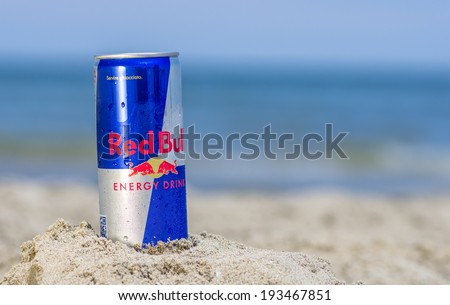 Rimini,Rivazzurra,IT. May 18,2014. Red Bull can on the beach.Red Bull is an energy drink sold by Red Bull GmbH, created in 1987. It is  the highest selling energy drink in the world.