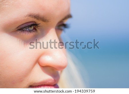 woman eyes close up on the beach