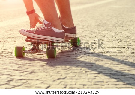 boy on a skater. view of a person riding on his skate just before making a freestyle trick.