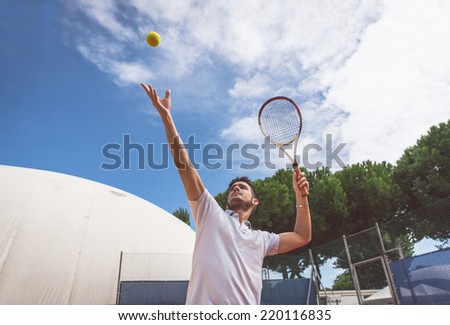 tennis player in action. a young athlete is ready to hit the ball on the tennis court