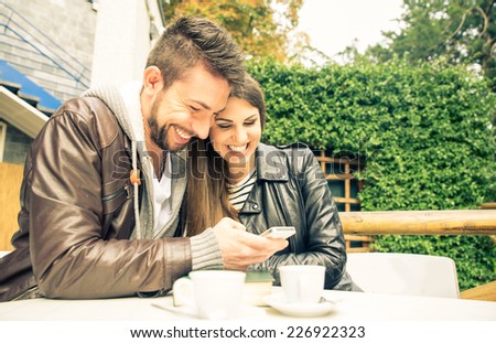 happy couple watching things on the smart phone. picture about technology and love