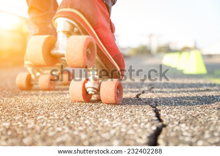 close up on skates. concept about sport and leisure. skater wants to perform a slalom between the cones