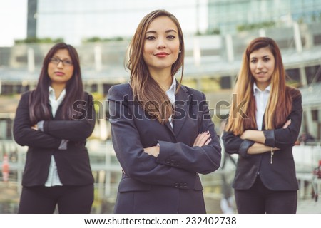 fine portrait of three young business women. concept about teamwork, business and finance