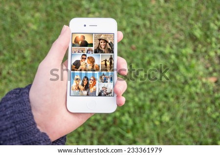 Woman holding a smart phone with collage of several lifestyle images - Phone with unforgettable memories