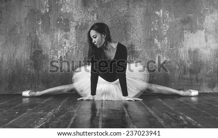 classic dancer performing split on the floor