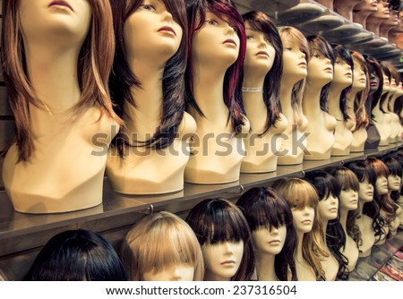 Wig shop - Row of mannequins in a peruke shop - Concepts about hairstyle,fashion and beauty