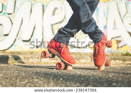 boy making cross position on roller skates