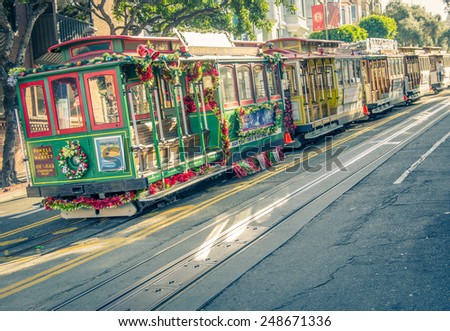 SAN FRANCISCO,CA - DECEMBER 15, 2013: cable cars driving around San Francisco.Cable cars is the most common public transport and also an attraction for tourists in San Francisco.
