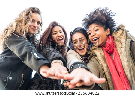 Group of attractive young women of different ethnics - Four students smiling at camera - Best friends spending time together