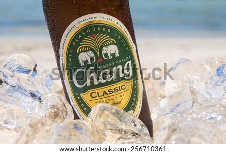 PHI PHI ISLAND,THAILAND - FEBRUARY 27, 2015: Chang beer on the beach, a pale lager brewed by ThaiBev, Thailand\'s largest and one of Southeast Asia\'s largest beverage companies