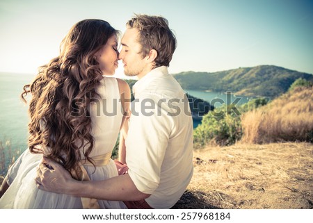 Couple in love kissing at sunset - Lovers on a romantic date outdoors