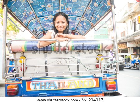 Asian woman on a taxi tuk tuk in Bangkok,Thailand