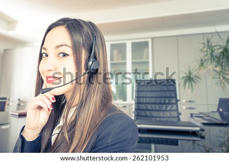 woman with headset with office background. concept about business, finance, job,career,people, insurances, and assistance