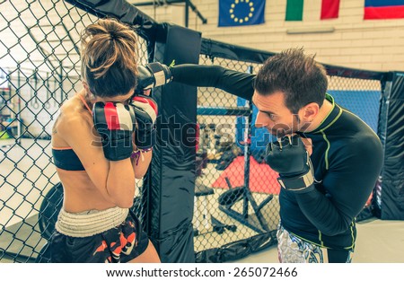 mma fighting training in the cage. concept about martial arts, sport, training, fitness and people