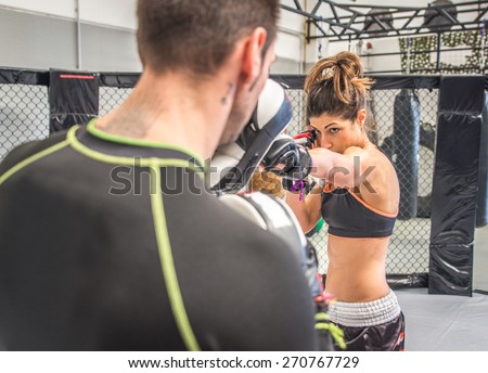 mma fighting training in the cage. concept about sport, fitness,mma,kickboxing,training, and people