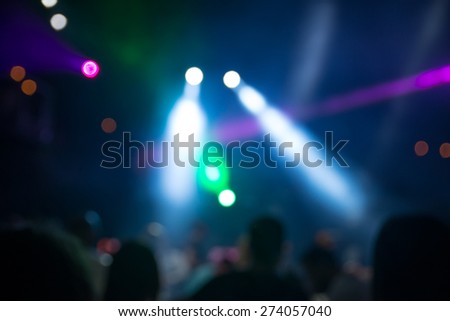 blurred disco party. defocused concept about disco night party. people dancing in the mix of music and lights