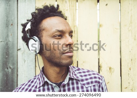 young african man listening to music. Concept about people, diversity,racism, youth, culture and people
