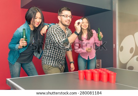 group of friends playing beer pong. concept about students, and games with friends