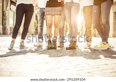 group of friends walking in the city center. concept about people, different styles, fashion trends and urban lifestyle