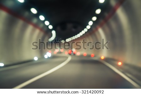 traffic jam concept in the tunnel. blurred image of cars on the speedway inside tunnel. concept about transportation